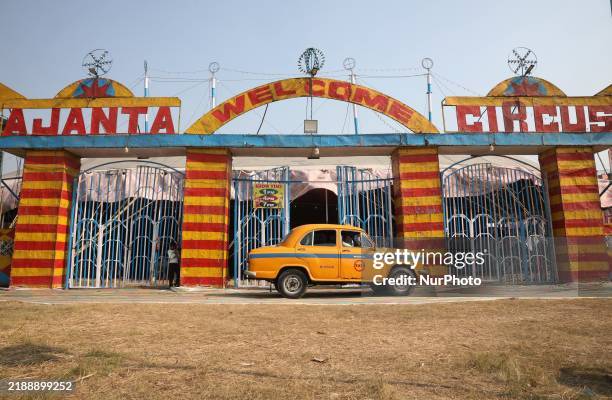Yellow ambassador taxi parks in front of the Ajanta Circus entry gate in Kolkata, India, on December 12, 2024. There are currently fewer than 30...