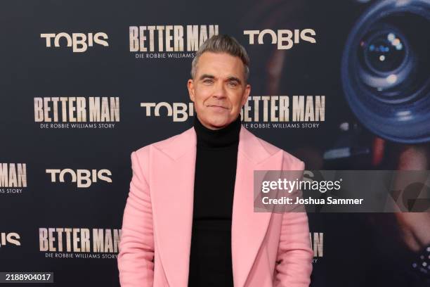 Robbie Williams attends the premiere of "Better Man - Die Robbie Williams Story" at Cinedom on December 08, 2024 in Cologne, Germany.