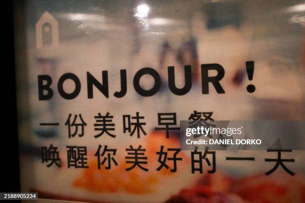 Sign reads Bonjour A delicious breakfast wakes you up for a good day as seen in Xian China on 9 November 2024.