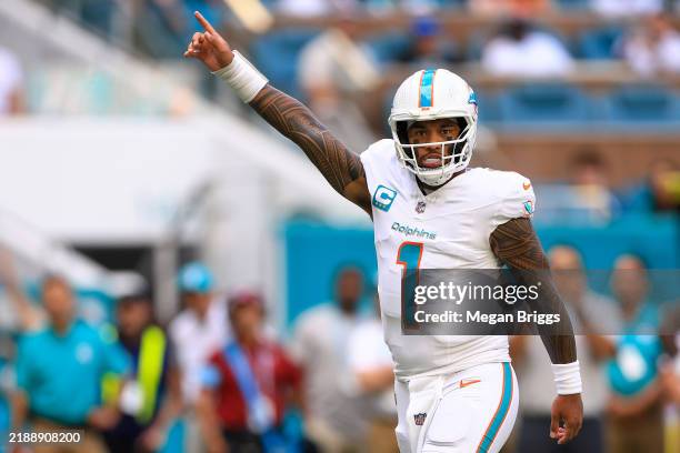 Tua Tagovailoa of the Miami Dolphins reacts after a touchdown in the first quarter of a game against the New York Jets at Hard Rock Stadium on...