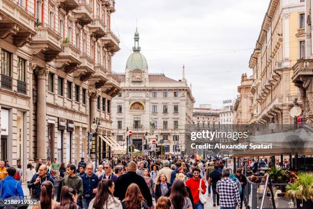 tourists walking on via dante shopping street in milan, italy - milano via dante stock pictures, royalty-free photos & images