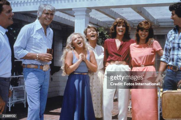 Cast members from the television series, 'Dallas' laughing on the set, c. 1980. Jim Davis , Charlene Tilton, Barbara Bel Geddes, Linda Gray, Victoria...