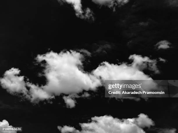 white clouds on black background - wolkengebilde stock-fotos und bilder