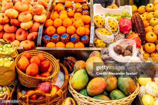 fresh fruits for sale on market stall at a farmer's market - organismo vivo imagens e fotografias de stock