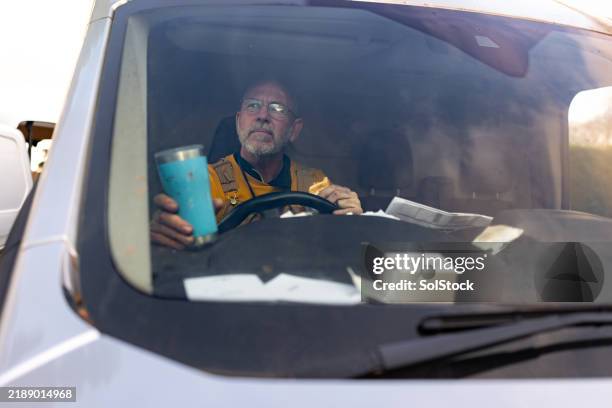 builder enjoying a break alone - builder van stock pictures, royalty-free photos & images