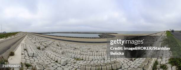 panoramic photo 30 km longer and 90 metres wide afsluitdijk between wadden sea and ijsselmeer, holland, netherlands - afsluitdijk stockfoto's en -beelden