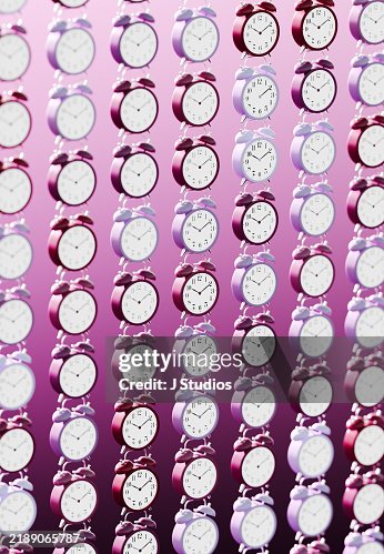 Array of Hovering Alarm Clocks in a Grid Pattern with Various Tones of Purple and Selective Focus Array of Hovering Alarm Clocks in a Grid Pattern with Various Tones of Purple and Selective Focus