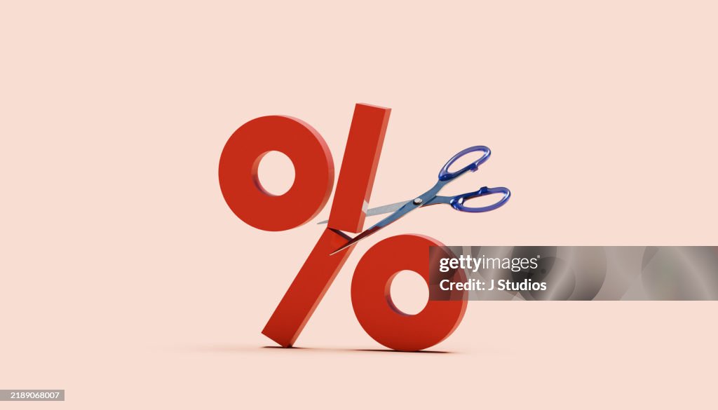 Percentage sign cut in half by scissor
