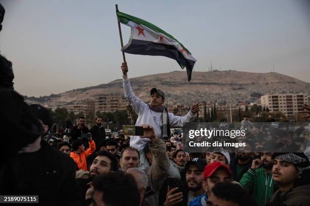 Anti-Assad citizens in Damascus celebrate after Assad fled the country and Damascus was taken over by the National Syria Army on December 9, 2024 in...