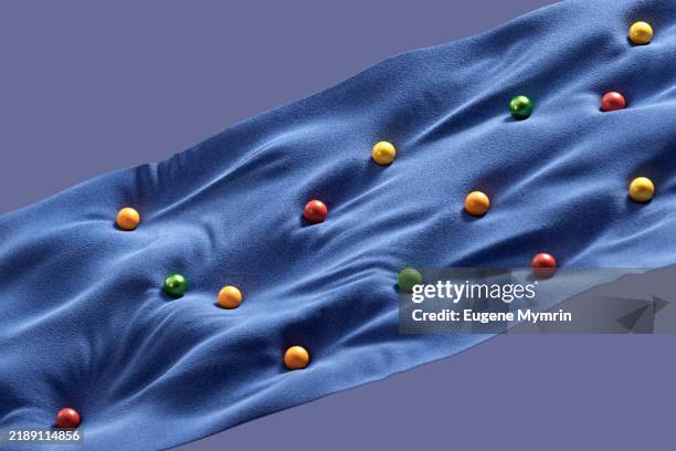 colorful spheres rolling on a wavy blue fabric: data flow visualization - changing cloths stock pictures, royalty-free photos & images