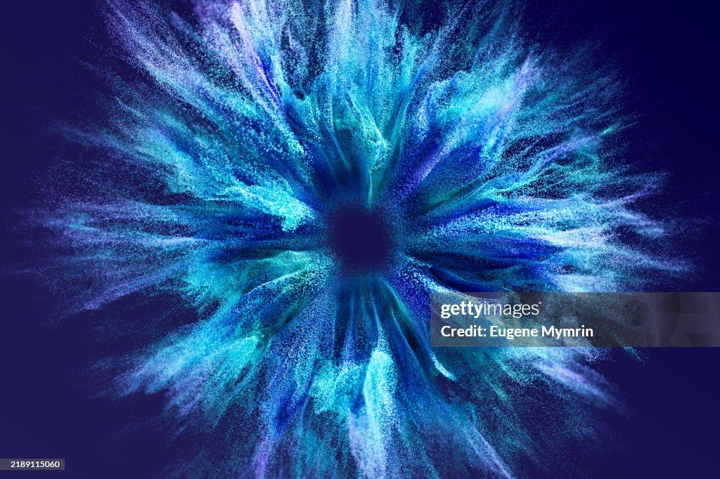 Colorful particles exploding from the center creating a futuristic effect