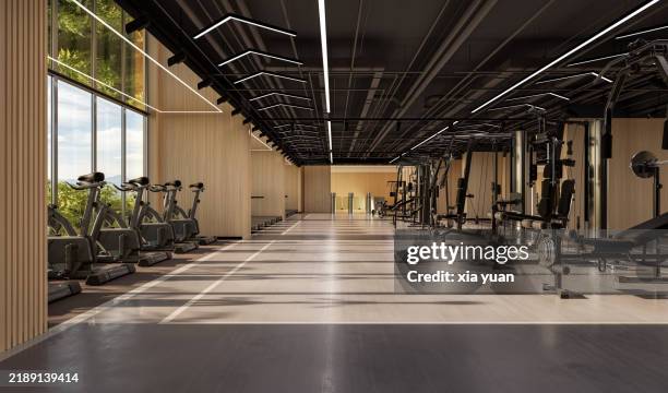 group of spin bikes in a exercising classroom at the gym - physical education stock pictures, royalty-free photos & images