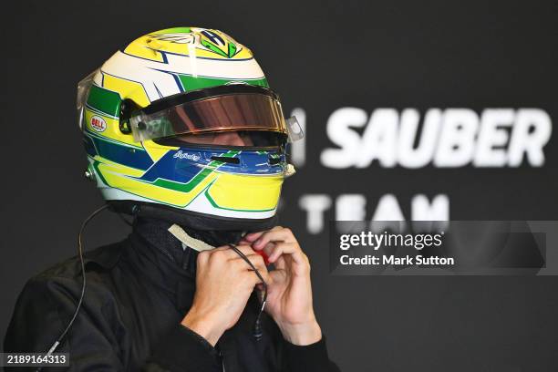 Gabriel Bortoleto of Brazil and Stake F1 Team Kick Sauber prepares to drive in the garage during Formula 1 testing at Yas Marina Circuit on December...