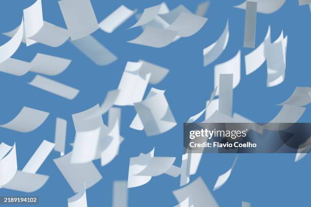 throwing paper sheets in the air - arremessar imagens e fotografias de stock