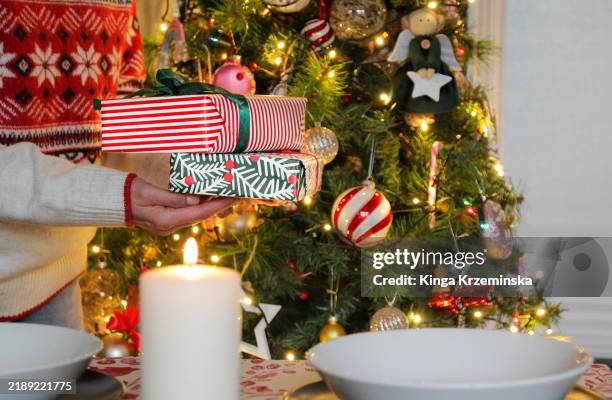 giving presents at christmas - eastern european culture stock pictures, royalty-free photos & images