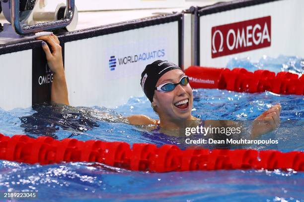 Gretchen Walsh of the United States celebrates after breaking the world record in the Women's 50m Butterfly Semifinal during day one of the World...