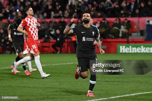 Mohamed Salah of Liverpool celebrates scoring his team's first goal from the penalty spot during the UEFA Champions League 2024/25 League Phase MD6...