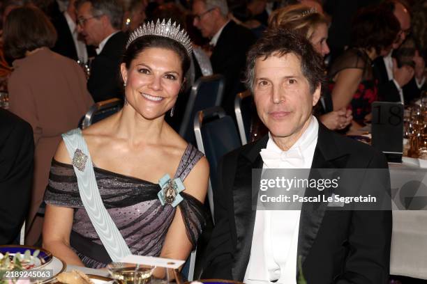 Crown Princess Victoria of Sweden and David Baker attend the Nobel Prize Banquet 2024 at Stockholm City Hall on December 10, 2024 in Stockholm,...