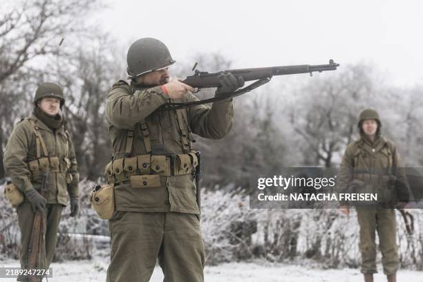 People dressed as soldiers pictured during the reenactment as part of the commemoration of the 80th anniversary of the Battle of the Bulge, or...