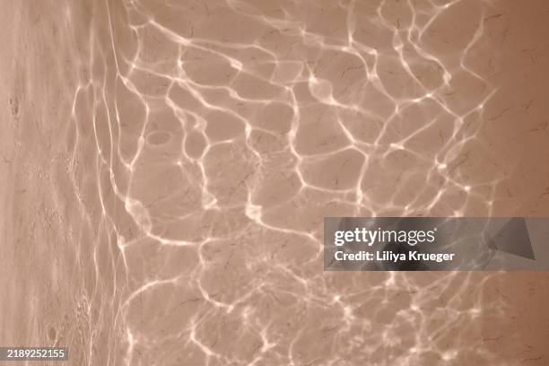 swimming pool surface with light reflection. - refraction stock pictures, royalty-free photos & images