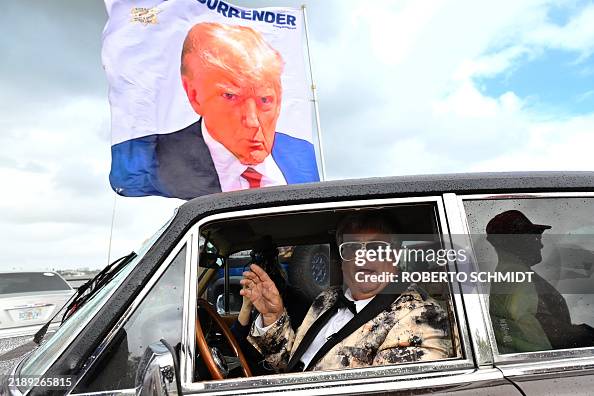 Eddy Shipek, a supporter of US President-Elect Donald Trump, parks ...