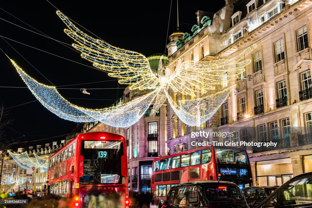The Christmas Angel Lights in Regent Street, London with Crowds of Tourists and Shoppers
