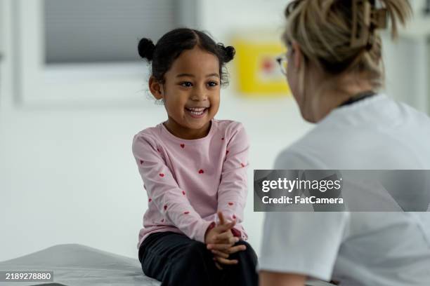 pediatric check-up - pediatrician stock pictures, royalty-free photos & images