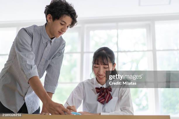 students taking cram school classes - cram school stock-fotos und bilder
