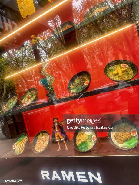 plastic dishes with samples of ramen at store window - fake food stock pictures, royalty-free photos & images