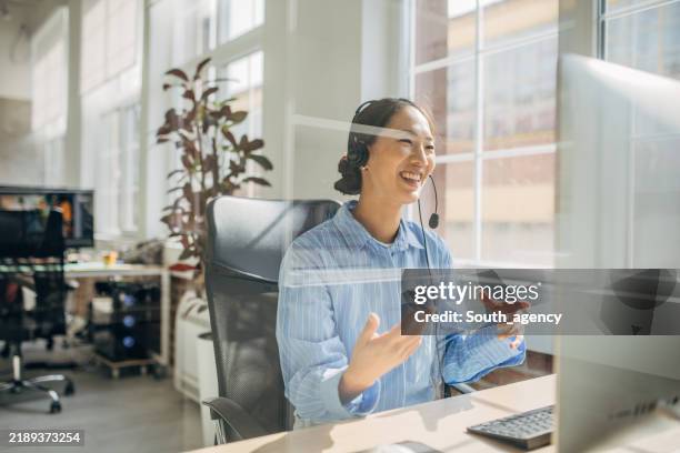 smiling female agent on video call with client - teacher zoom stock pictures, royalty-free photos & images