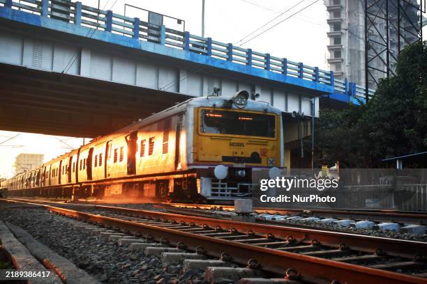 People travel on a Suburban Railway in Kolkata, India, on December 15, 2024.