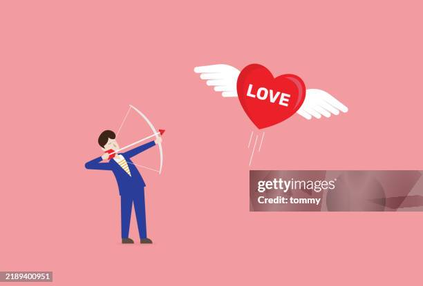 man shoot an arrow to love heart balloon for valentine's day concept - cupid stock illustrations