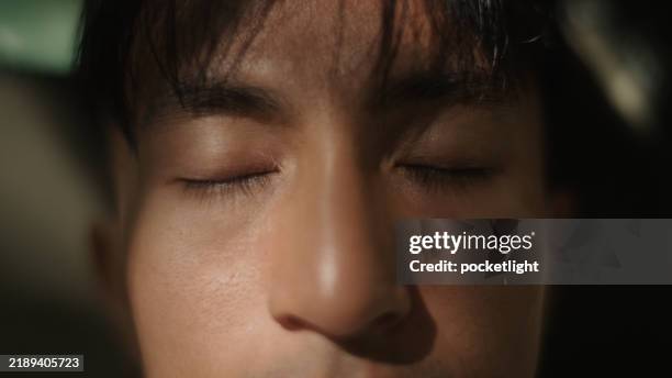 man resting in nature. - eyes closed stock pictures, royalty-free photos & images