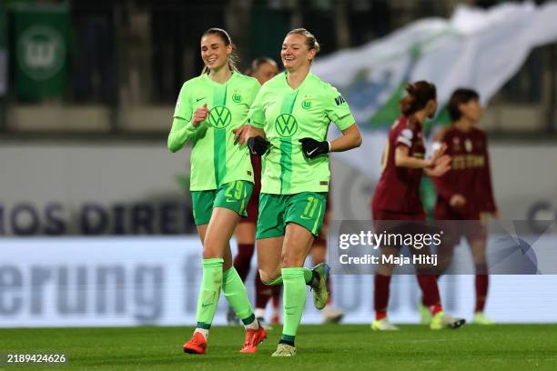 Alexandra Popp of VfL Wolfsburg celebrates scoring her team's first goal with teammate Jule Brand during the UEFA Women's Champions League match...