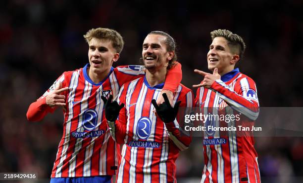 Antoine Griezmann of Atletico de Madrid celebrates with his teammates after scoring his team's second goal during the UEFA Champions League 2024/25...