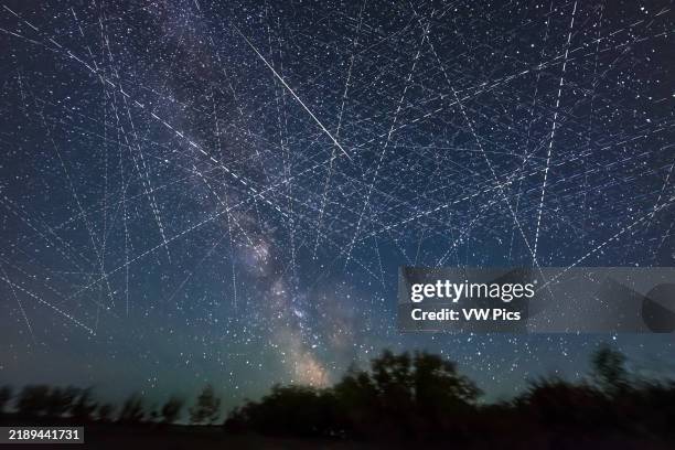 This depicts the satellite-filled sky that is now a reality and getting more crowded every week! This adds together exposures taken over just 30...