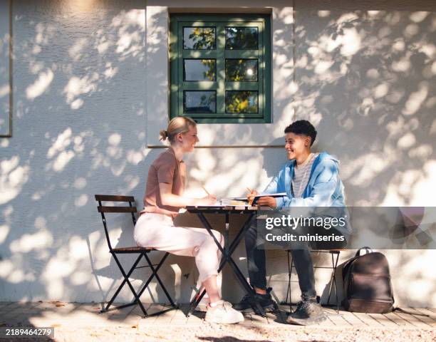 high school students studying together in outdoor setting - smart casual stock pictures, royalty-free photos & images