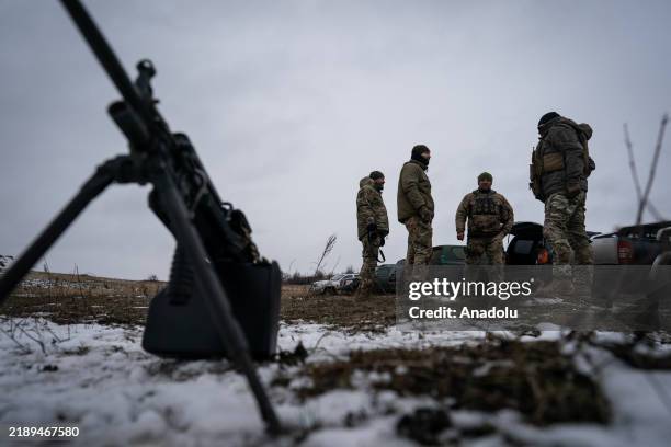 Ukrainian servicemen of 24th brigade are seen standing behind a light machine gun during a training exercise in Donetsk Oblast, Ukraine on 15...