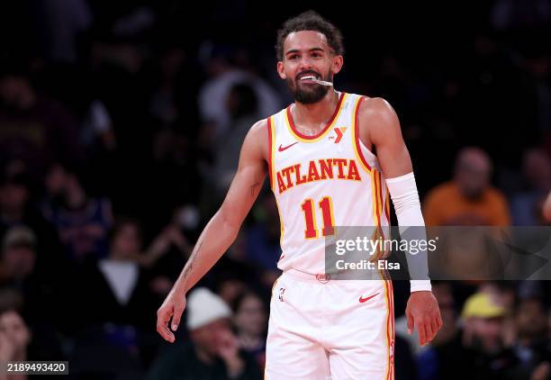 Trae Young of the Atlanta Hawks celebrates late in the fourth quarter of the quarterfinal game of the Emirates NBA Cup at Madison Square Garden on...