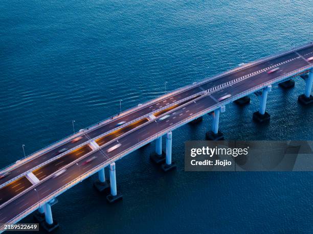 cross-sea bridge - bridge architecture up close night stock pictures, royalty-free photos & images