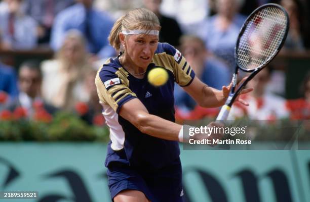 German tennis player Steffi Graf plays a backhand return during the Women's Singles final of the French Open at Stade Roland Garros in Paris, France,...