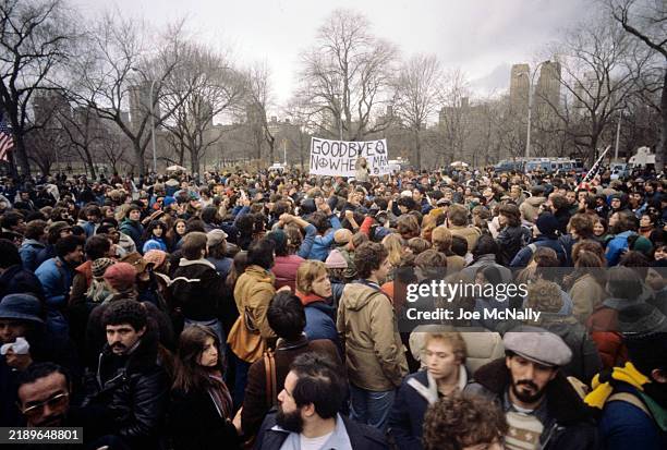 Fans of musician John Lennon gather to commemorate his death, following his assassination in 1980. New York City, NY. .