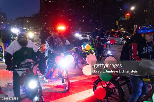 Immigrant food delivery workers from Mexico ride their bicycles through the streets of East Harlem in a religious procession for Our Lady of...