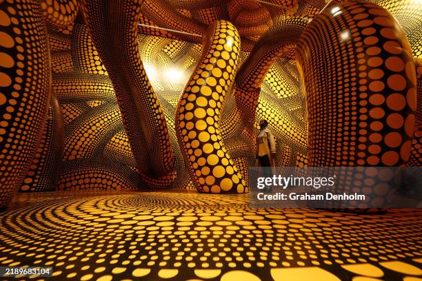 Visitors view the Yayoi Kusama exhibition at National Gallery of Victoria on December 13, 2024 in Melbourne, Australia.