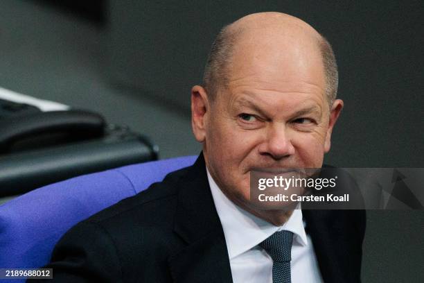 German Chancellor Olaf Scholz reacts during the debate to face a vote of confidence at the Bundestag on December 16, 2024 in Berlin, Germany. Scholz...