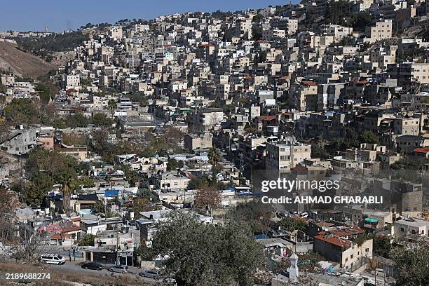 Picture shows a view of the Arab town of Silwan on the hill with its al-Bustan neighbourhood in Israeli-annexed east Jerusalem on December 16, 2024....