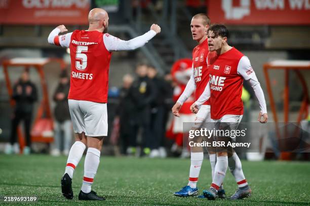 Bryan Smeets of MVV Maastricht celebrates the victory with Simon Francis of MVV Maastricht and Tim Zeegers of MVV Maastricht during the Dutch Keuken...