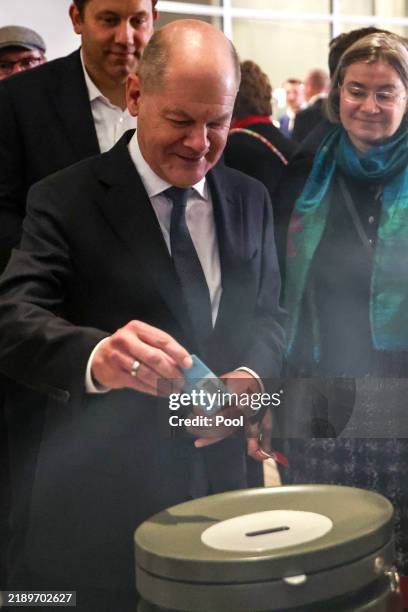 German Chancellor Olaf Scholz casts his vote during a vote of confidence at the Bundestag on December 16, 2024 in Berlin, Germany. Scholz requested...
