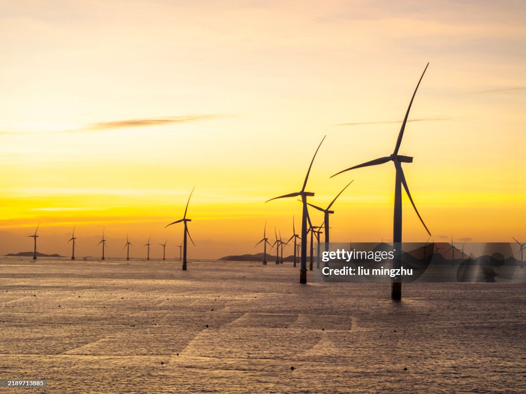 Offshore wind turbines under beautiful morning sky