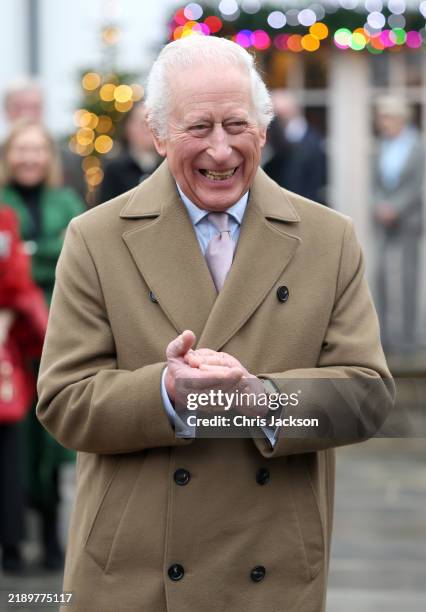 King Charles III smiles as he arrives for the The King's Foundation's annual 'Crafts at Christmas' at Highgrove Gardens on December 13, 2024 in...